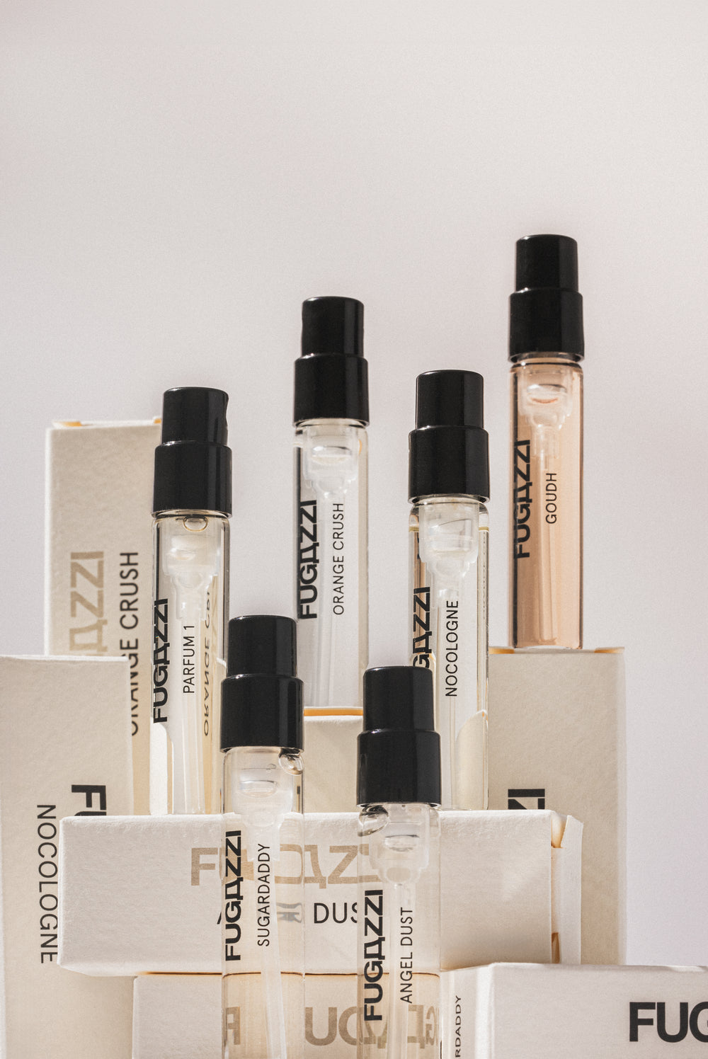 Fugazzi fragrance surrounded by pomegranate seeds
