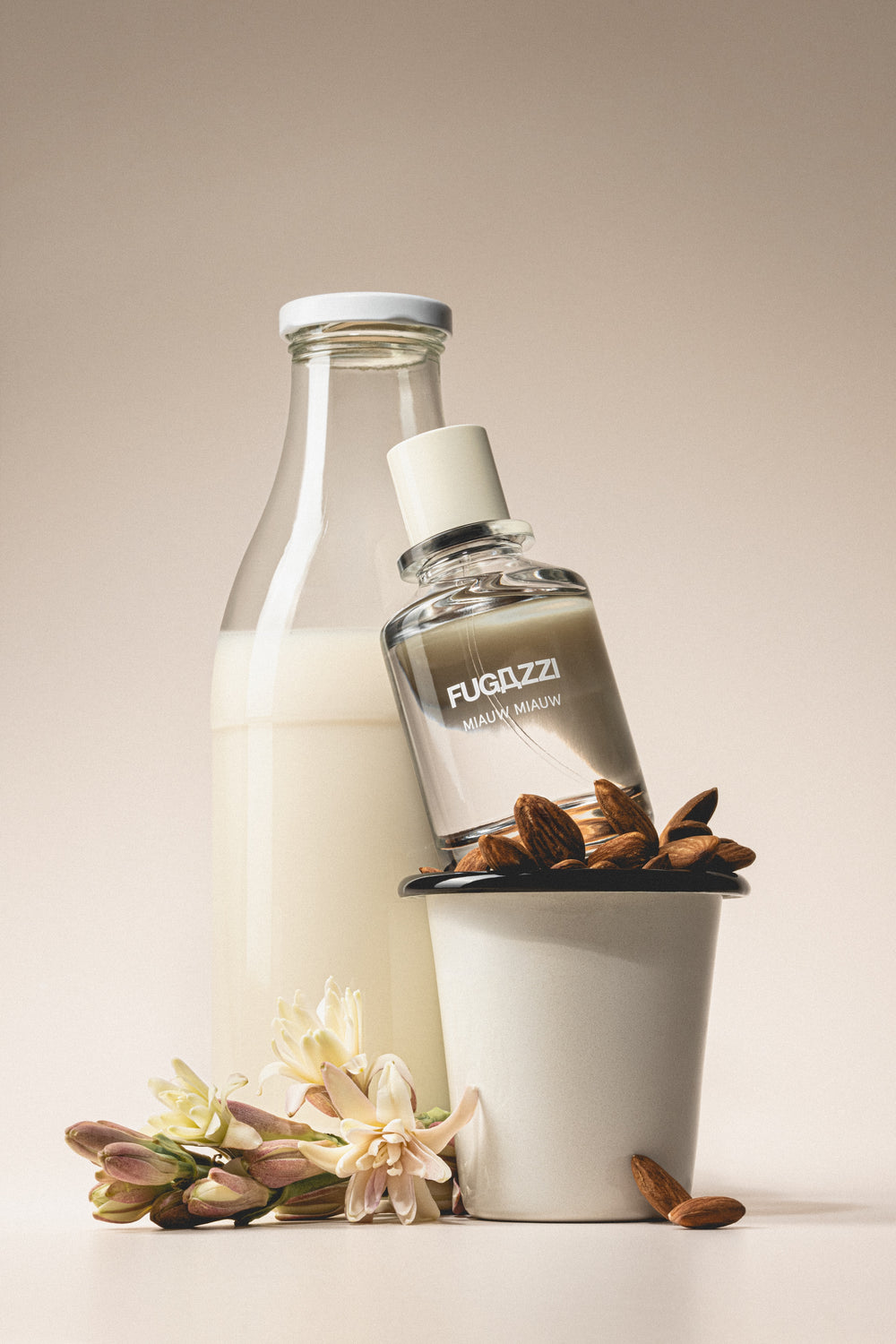Fugazzi fragrance surrounded by pomegranate seeds