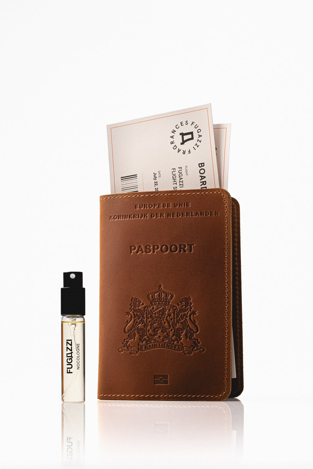 Fugazzi fragrance held against a dark suit