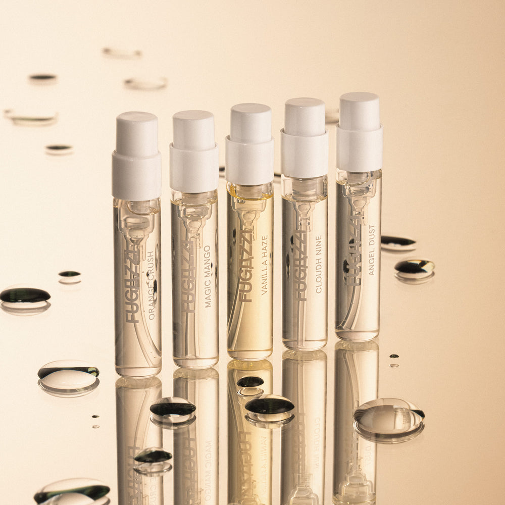 Fugazzi fragrance surrounded by pomegranate seeds