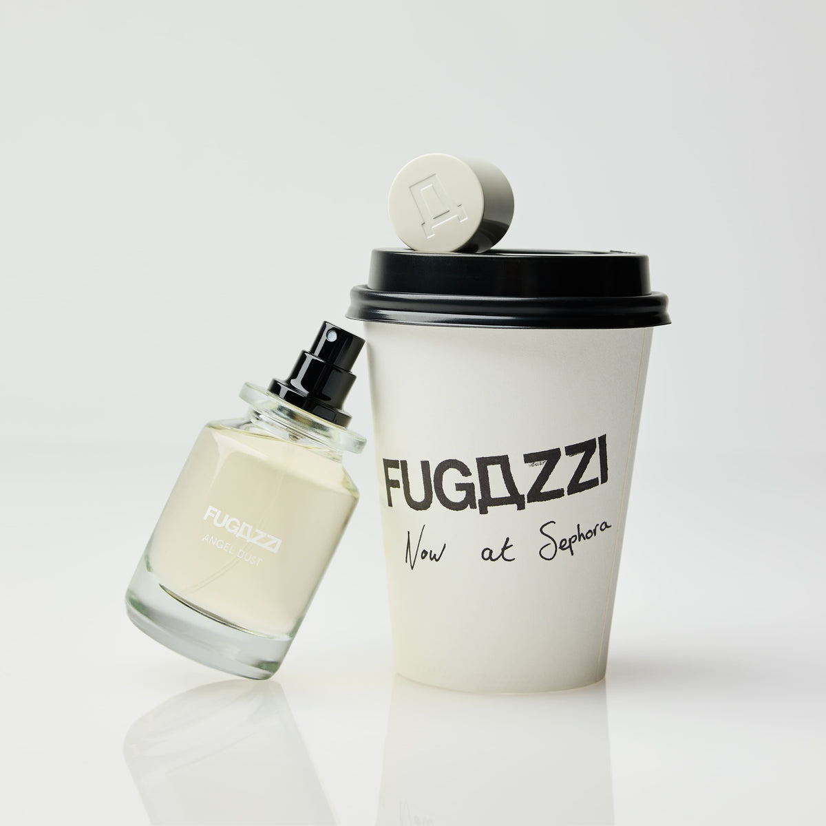 Model holding a Fugazzi fragrance