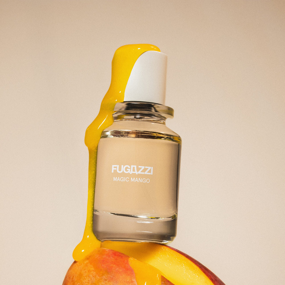 Fugazzi fragrance surrounded by pomegranate seeds
