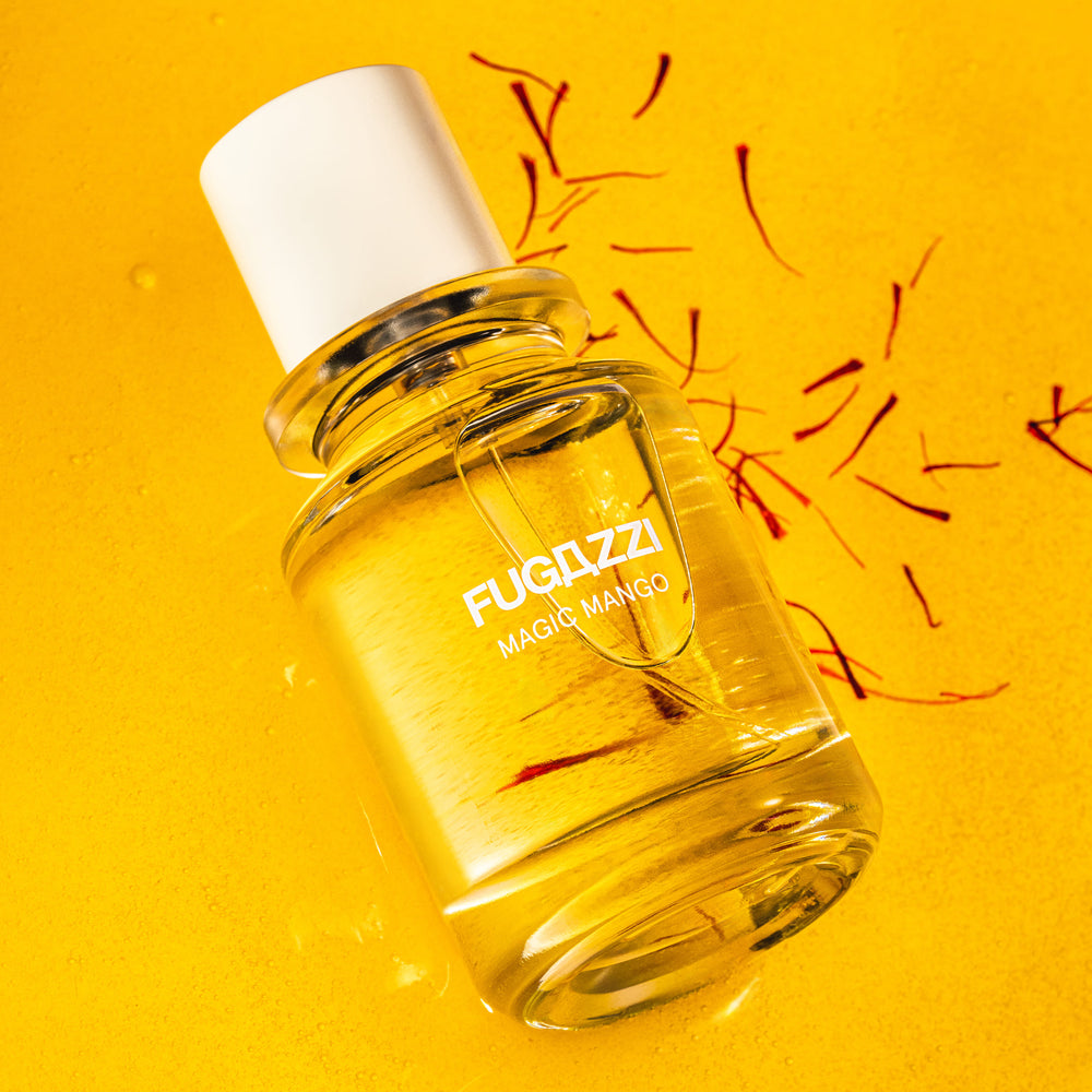 Fugazzi fragrance surrounded by pomegranate seeds