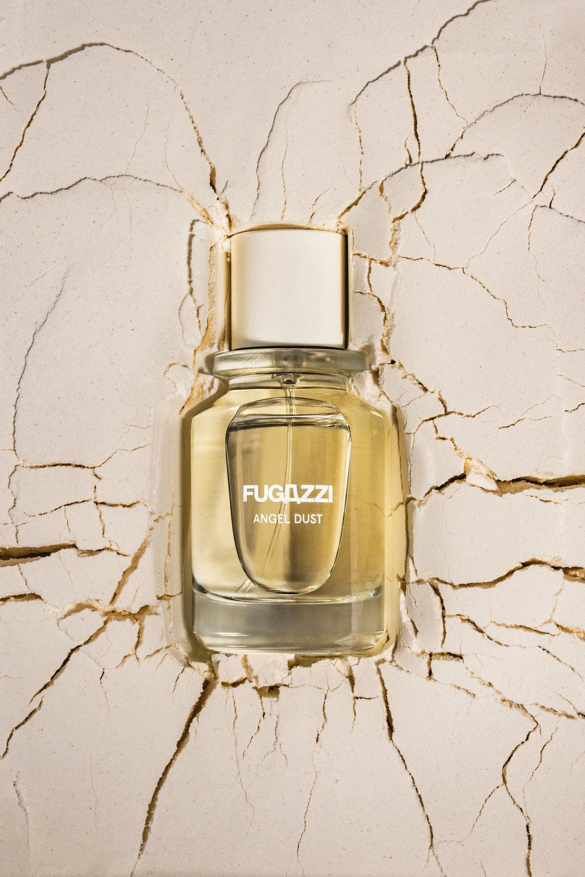 Model holding a Fugazzi fragrance