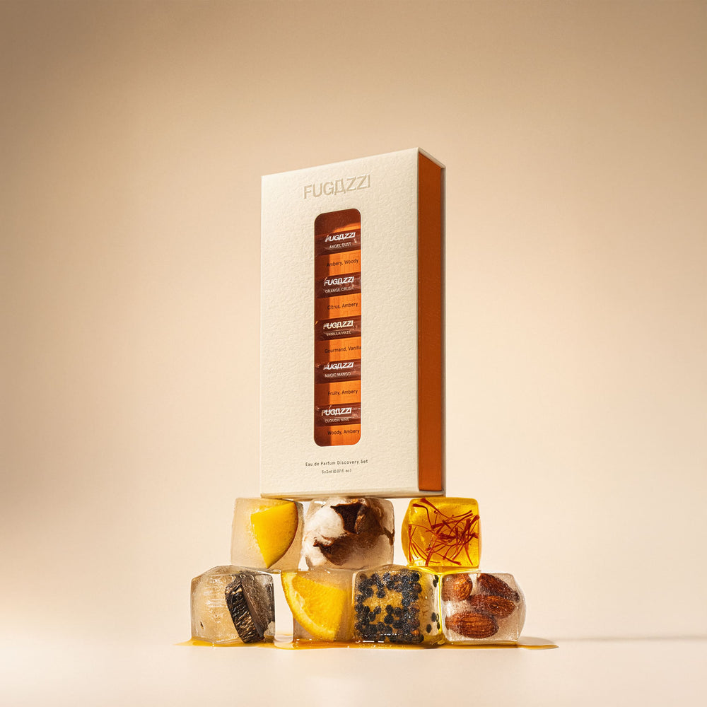 Fugazzi fragrance held against a dark suit