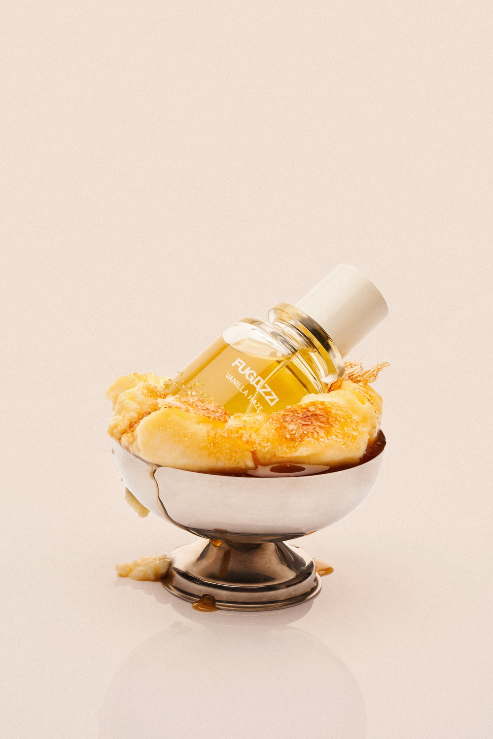 Fugazzi fragrance held against a dark suit
